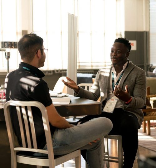 photo-of-men-having-conversation-935949